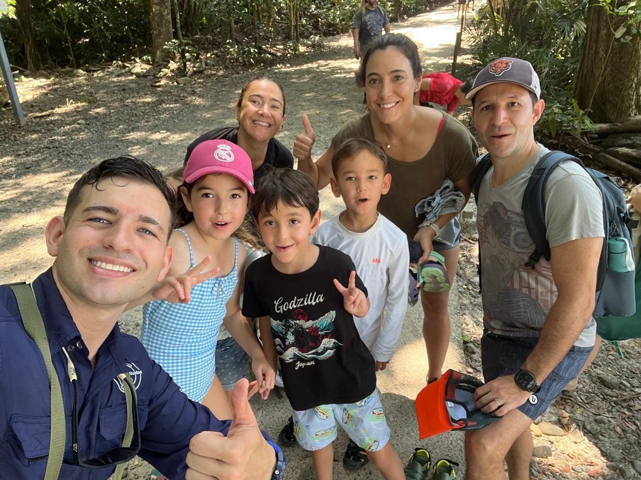Family walking the Manuel Antonio National Park trails with their guide